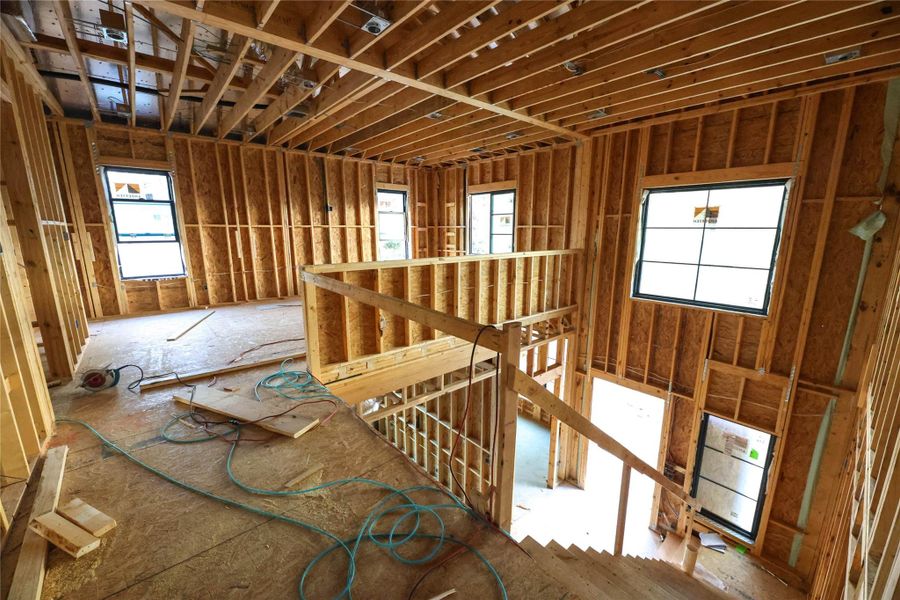 View from the 2nd Floor overlooking Front entry & 2nd Floor Game Room. Many Windows allow natural light to flow through the home.