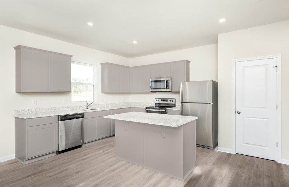 Package B Kitchen with beautiful gray cabinets and quartz countertops.