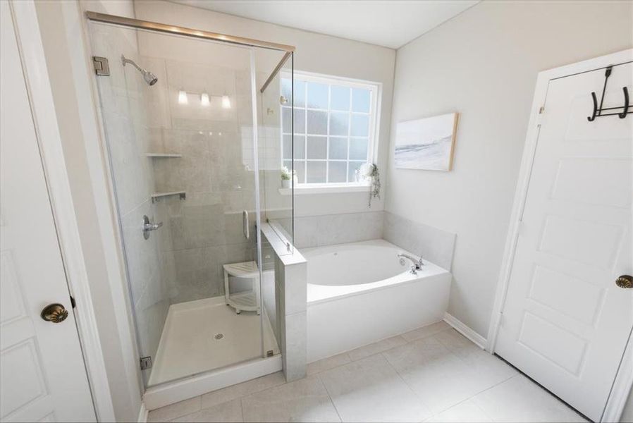 Primary bathroom with a tiled walk-in shower, a garden bath, and light tile patterned floors Primary bathroom with a tiled walk-in shower, a garden bath, and light tile patterned floors