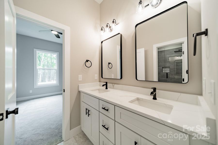 The Lower Level Full Bathroom serves Bedroom 3 and 4 with stunning Quartz Countertops