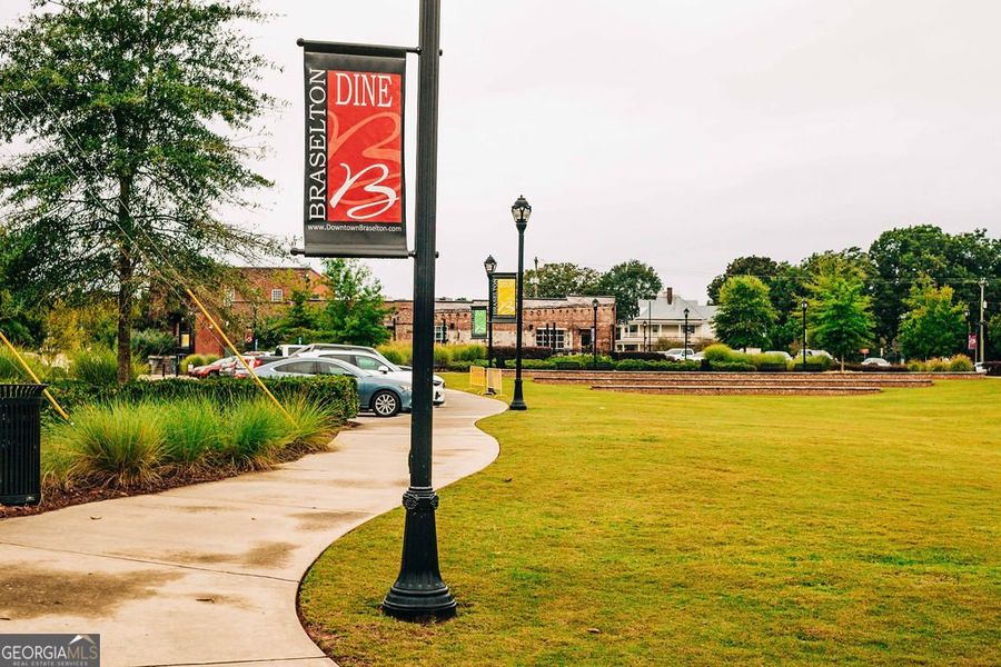 Front exterior of a new home in Rosewood Lake Estates, Hoschton, GA, highlighting curb appeal (Image 42).