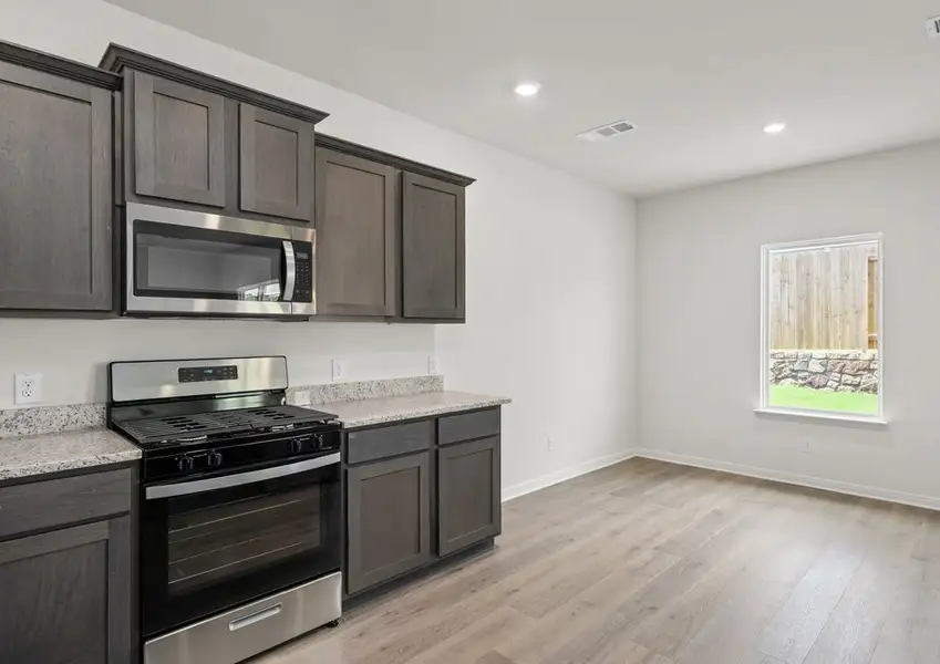 The dining room sits right off of the kitchen. The dining room sits right off of the kitchen.