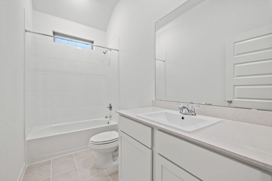Bathroom in the Birch home plan by Trophy Signature Homes – REPRESENTATIVE PHOTO
