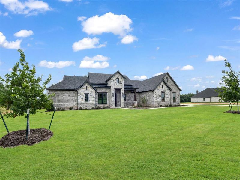 Front exterior of a new home in , Weatherford, TX, highlighting curb appeal (Image 22).