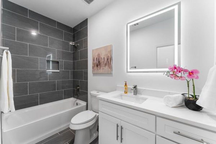 Bathroom with shower / bath combination and vanity Bathroom with shower / bath combination and vanity