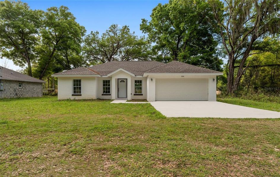 Front exterior of a new home in , Summerfield, FL, highlighting curb appeal (Image 2). Front exterior of a new home in , Summerfield, FL, highlighting curb appeal (Image 2).