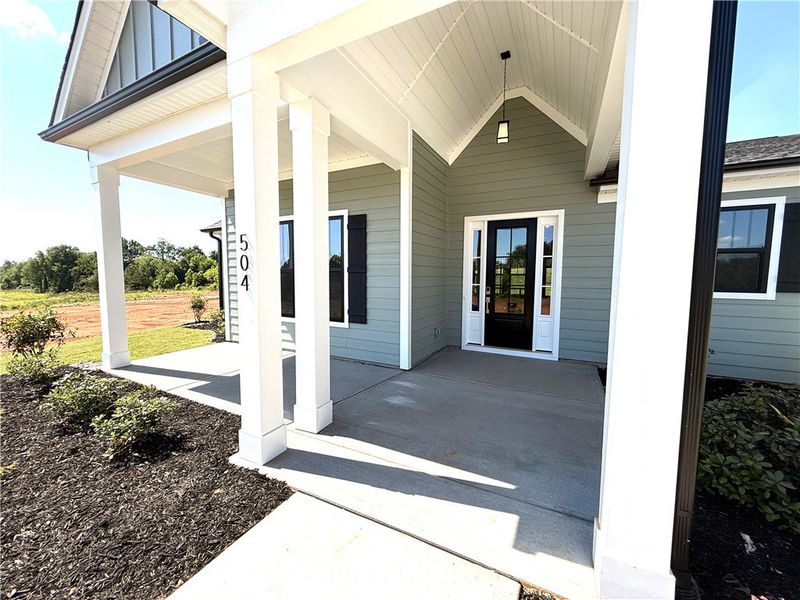 Welcome to a charming front entry, offering a warm