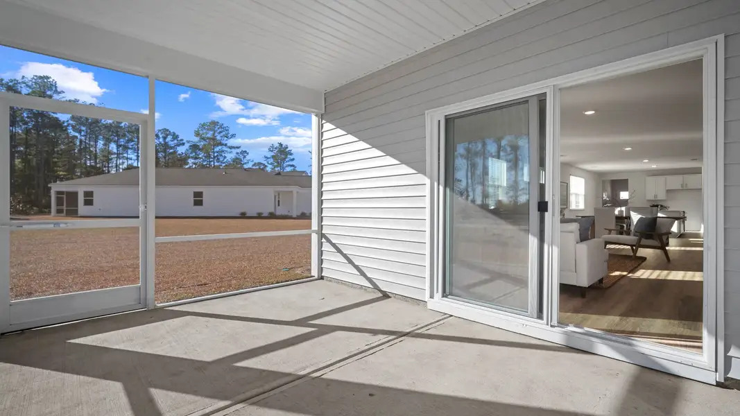 Exterior details and patio area of a home in The Lakes at North Glynn, Brunswick (Image 3).