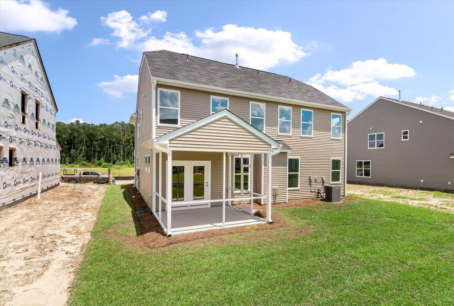 Front exterior of a new home in Oakley Pointe, Moncks Corner, SC, highlighting curb appeal (Image 1).