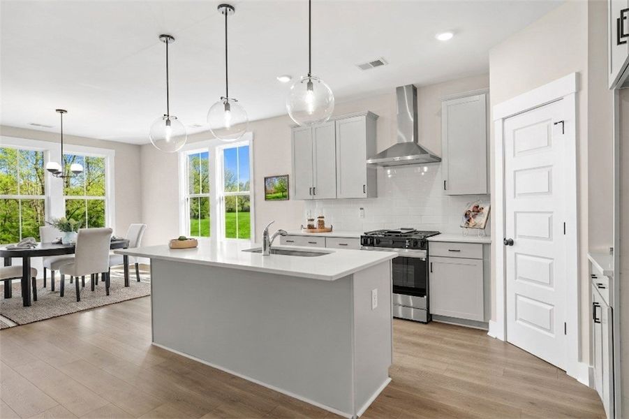 This bright kitchen features a functional island a