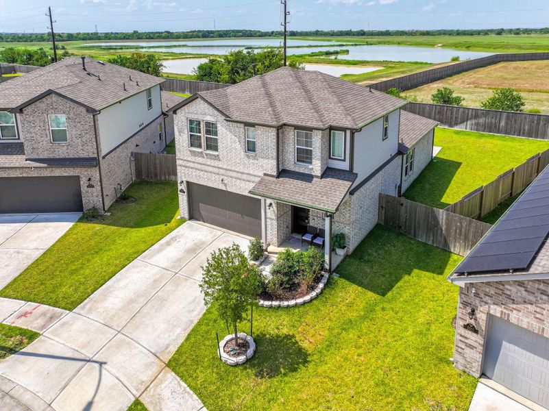 Front exterior of a new home in Lonestar Collection at Aurora, Katy, TX, highlighting curb appeal (Image 20). Front exterior of a new home in Lonestar Collection at Aurora, Katy, TX, highlighting curb appeal (Image 20).