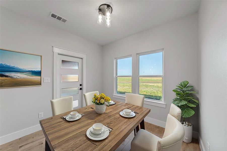 Virtual Staging Dining area with light wood-type flooring