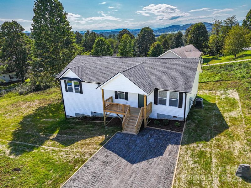 Front exterior of a new home in , Hendersonville, NC, highlighting curb appeal (Image 21).