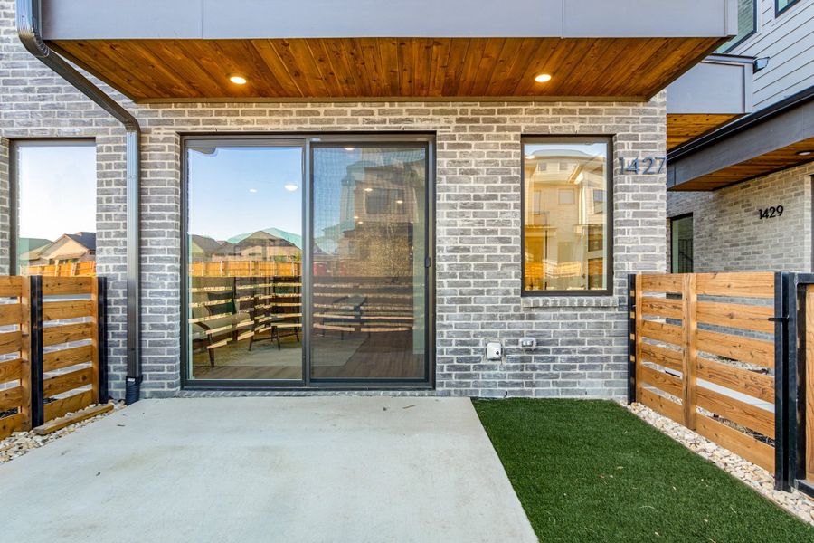 Exterior details and patio area of a home in Willow Grove Townhomes, Melissa (Image 3).