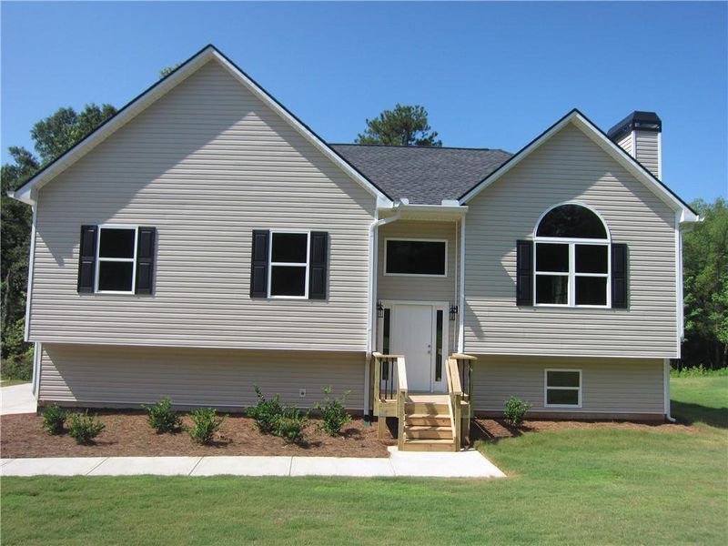 Front exterior of a new home in , Dallas, GA, highlighting curb appeal (Image 20).