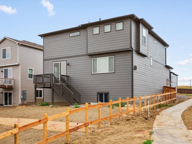 Front exterior of a new home in Buffalo Highlands: The Flora Collection, Commerce City, CO, highlighting curb appeal (Image 17). Front exterior of a new home in Buffalo Highlands: The Flora Collection, Commerce City, CO, highlighting curb appeal (Image 17).