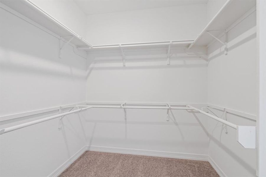 A view of your large primary walk-in Closet