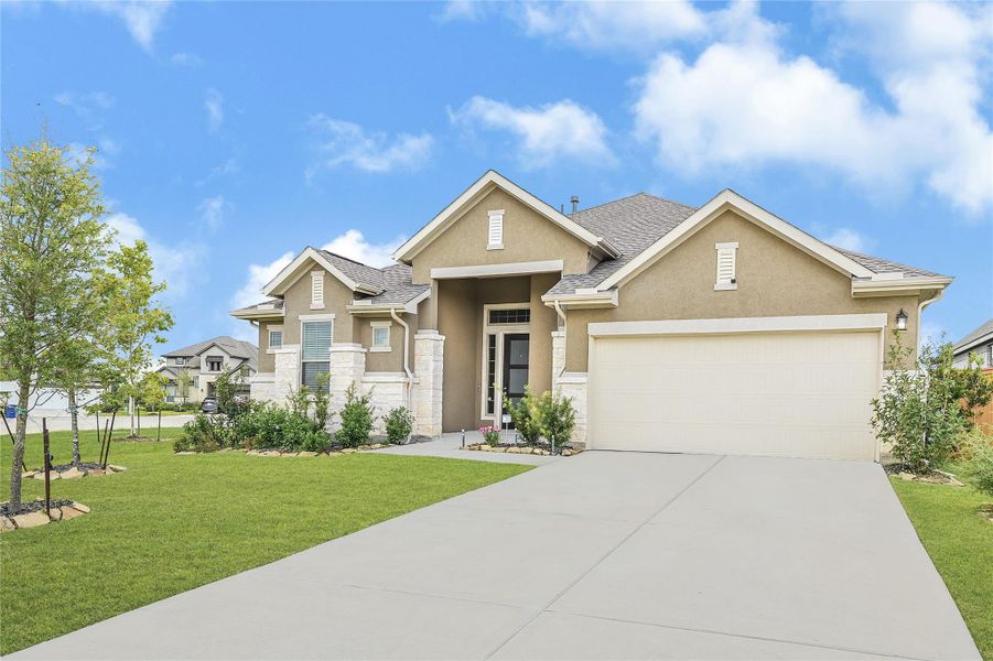 Front exterior of a new home in Lago Mar, Texas City, TX, highlighting curb appeal (Image 23). Front exterior of a new home in Lago Mar, Texas City, TX, highlighting curb appeal (Image 23).