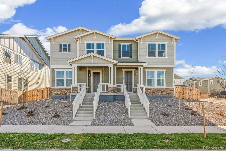 Front exterior of a new home in Turnberry, Commerce City, CO, highlighting curb appeal (Image 2).