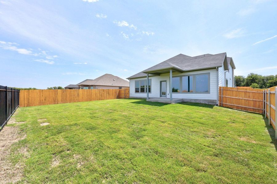 Exterior details and patio area of a home in Prairie Winds, Hutto (Image 24). Exterior details and patio area of a home in Prairie Winds, Hutto (Image 24).