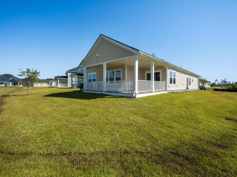 Exterior details and patio area of a home in The Coves at Lakes of Cane Bay, Summerville (Image 22).