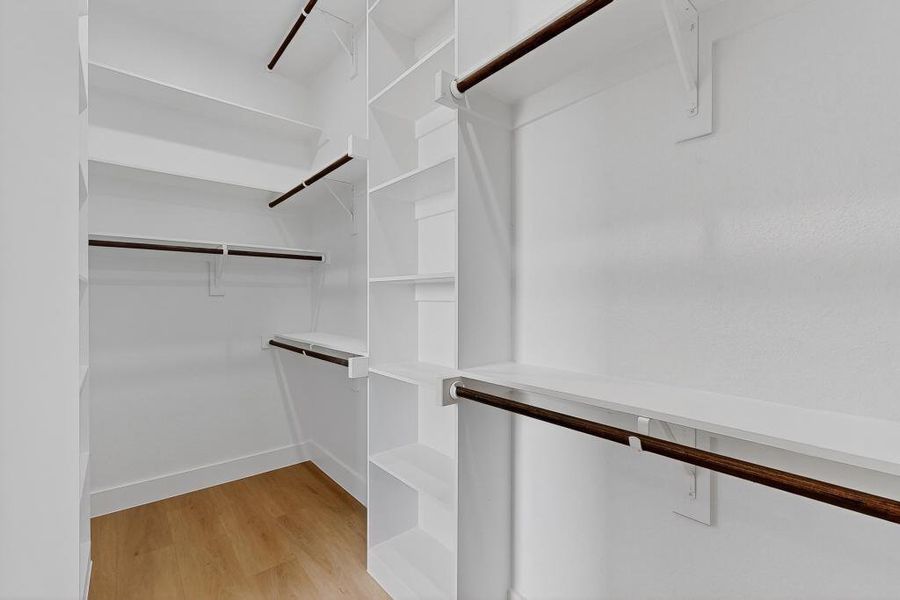 Walk in closet featuring light wood-type flooring