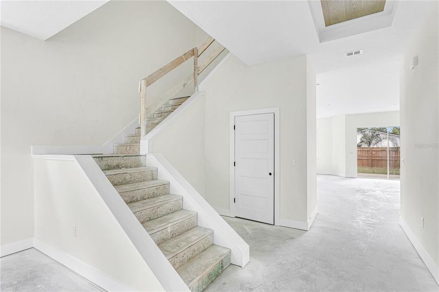 Stairs/ half bath/ foyer