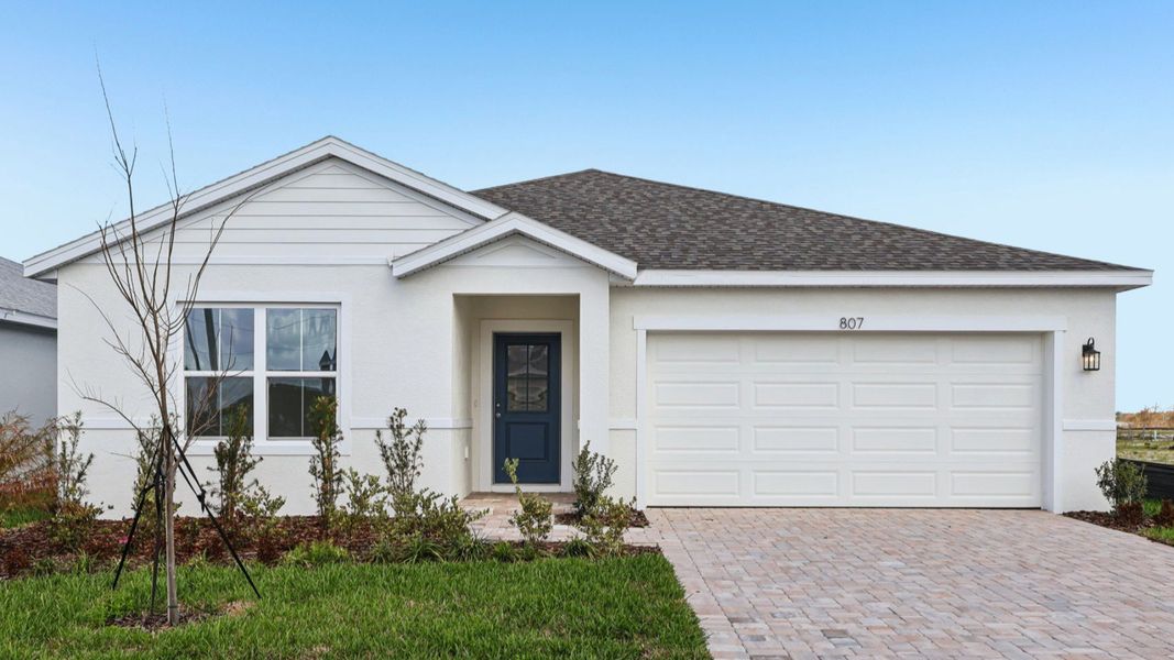 Representative exterior photo of a completed home built from the Baker by DRB Homes in Liberty Trace, Haines City, FL (Image 20).