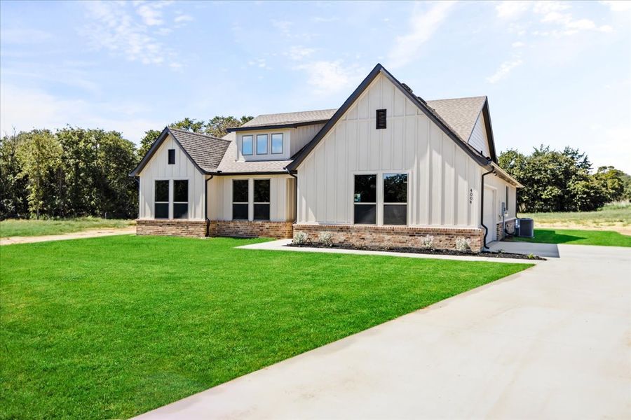 Front exterior of a new home in The Ranches at Valley View, Springtown, TX, highlighting curb appeal (Image 24).