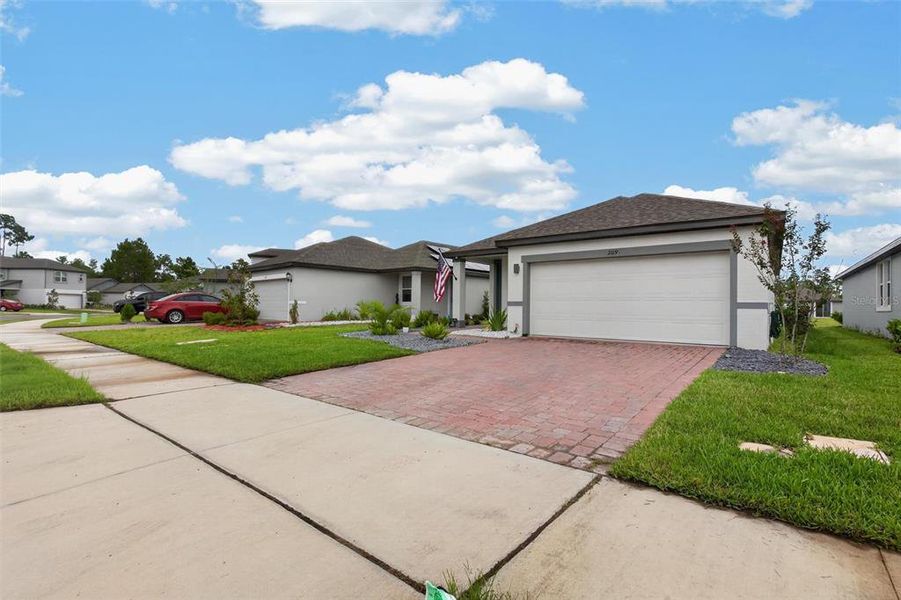 Front exterior of a new home in Links Terrace, Daytona Beach, FL, highlighting curb appeal (Image 22).