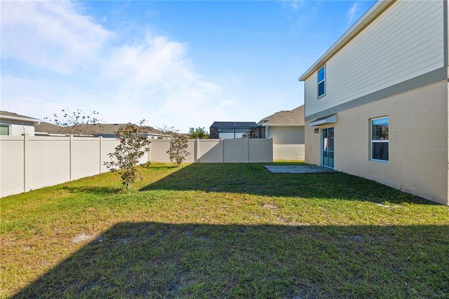 Exterior details and patio area of a home in Storey Creek: Manor Collection, Kissimmee (Image 21).