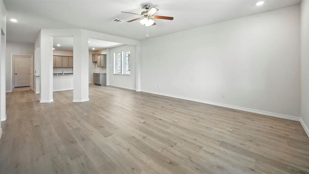 Unfurnished living room featuring recessed lighting, light wood-type flooring, and ceiling fan