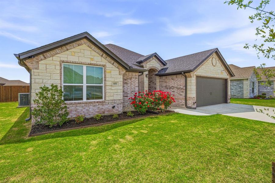 Front exterior of a new home in , Tolar, TX, highlighting curb appeal (Image 2). Front exterior of a new home in , Tolar, TX, highlighting curb appeal (Image 2).