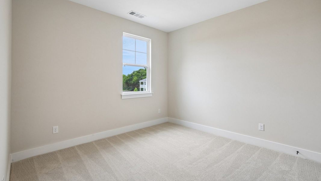 Bedroom with carpet and window Bedroom with carpet and window