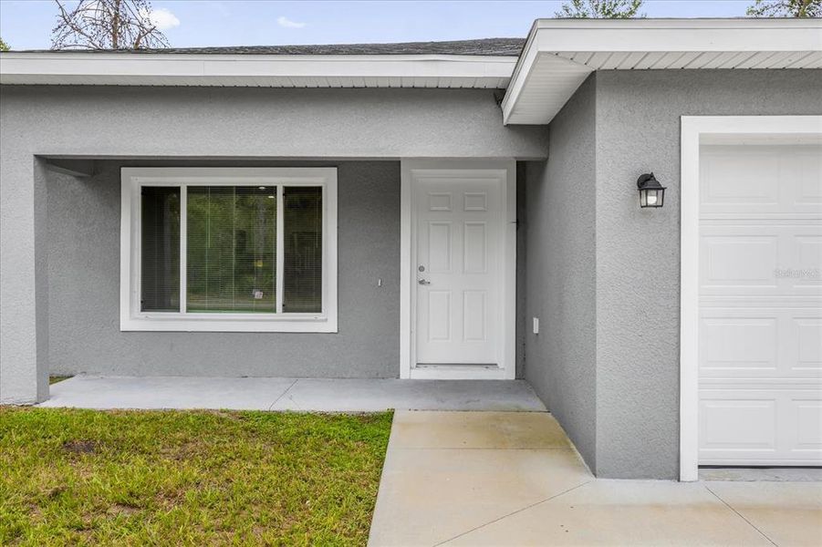 Front exterior of a new home in , Ocklawaha, FL, highlighting curb appeal (Image 2). Front exterior of a new home in , Ocklawaha, FL, highlighting curb appeal (Image 2).