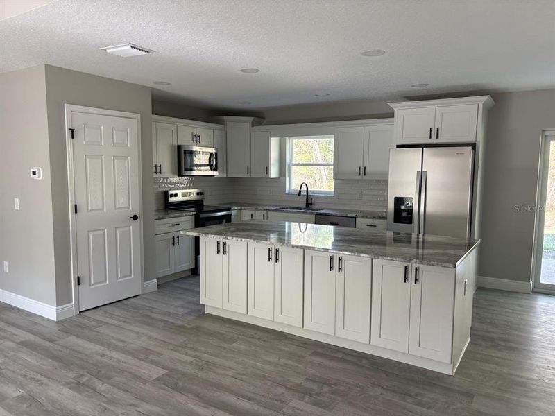 Furnished interior view inside a new home in , Dunnellon (Image 7).