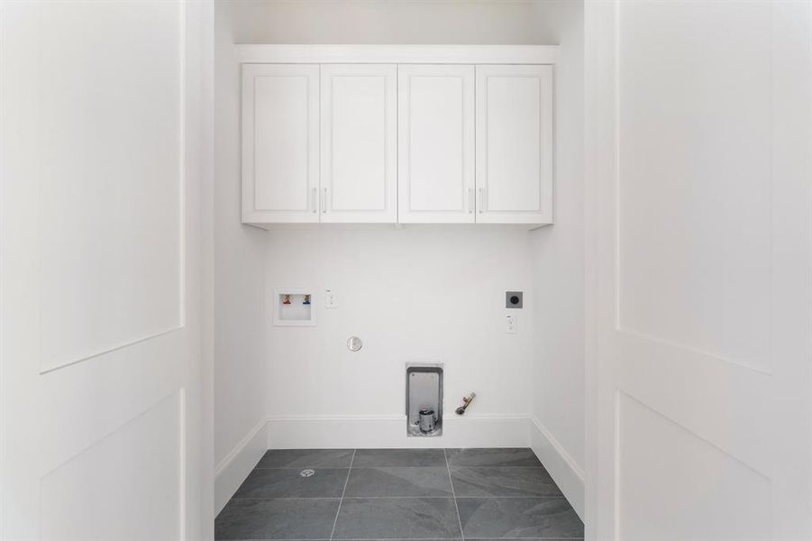 Conveniently located down the hall from the primary bedroom, the utility room sits on the third floor. (photo of interior model home with smaller floor plan)