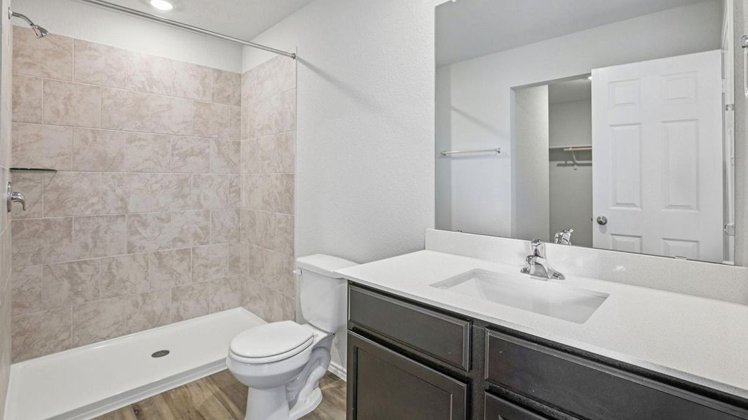 A well-appointed bathroom with a spacious walk-in shower and modern vanity. A well-appointed bathroom with a spacious walk-in shower and modern vanity.