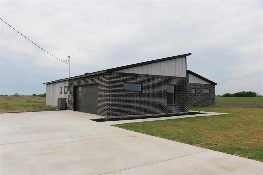 Front exterior of a new home in , Avalon, TX, highlighting curb appeal (Image 1). Front exterior of a new home in , Avalon, TX, highlighting curb appeal (Image 1).