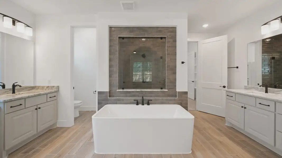 Representative furnished interior of a home built from the Waterloo by Chesmar Homes in Sofi Lakes, Katy (Image 8).