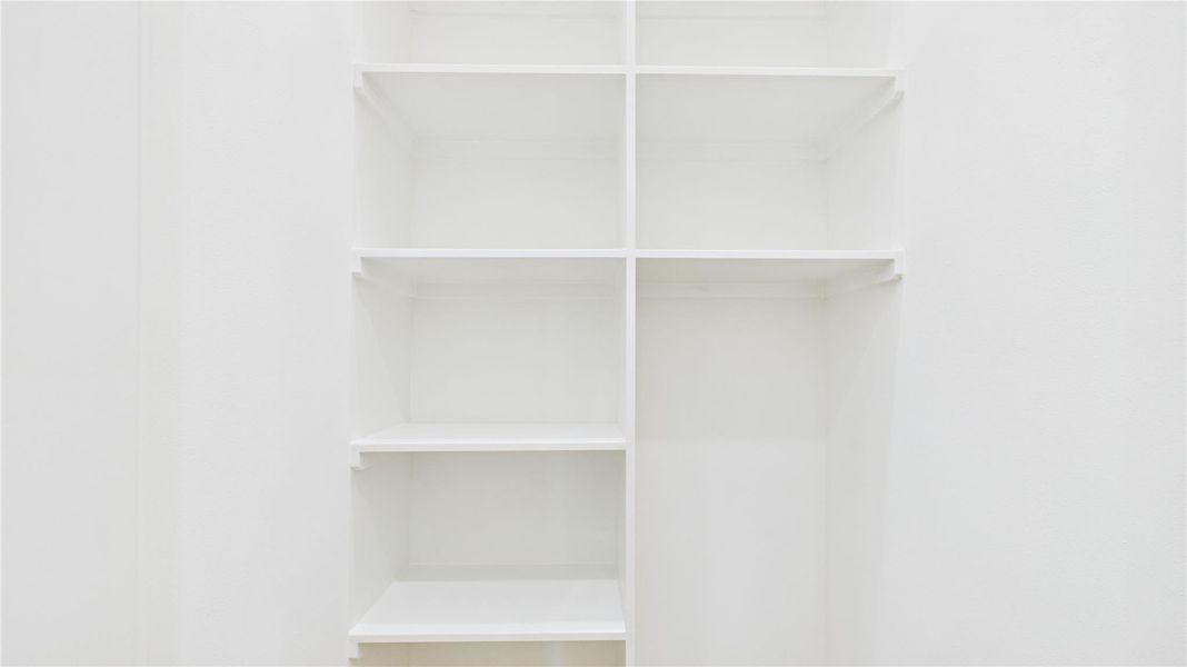 This photo shows a set of built-in shelving units, ideal for organized storage.