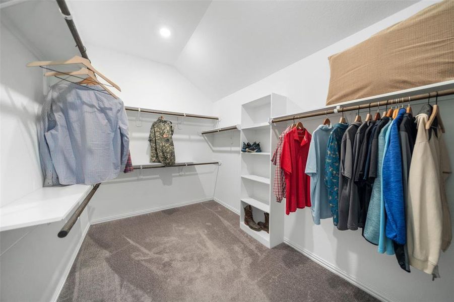 The large primary closet provides generous storage space, with plenty of room for clothing, accessories, and organization to meet all your needs.