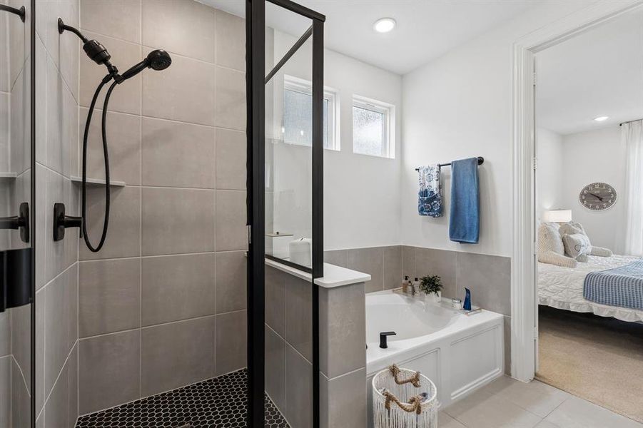 Enjoy a relaxing soak in the garden tub or refresh in the separate glass-enclosed shower, thoughtfully designed for both comfort and convenience.