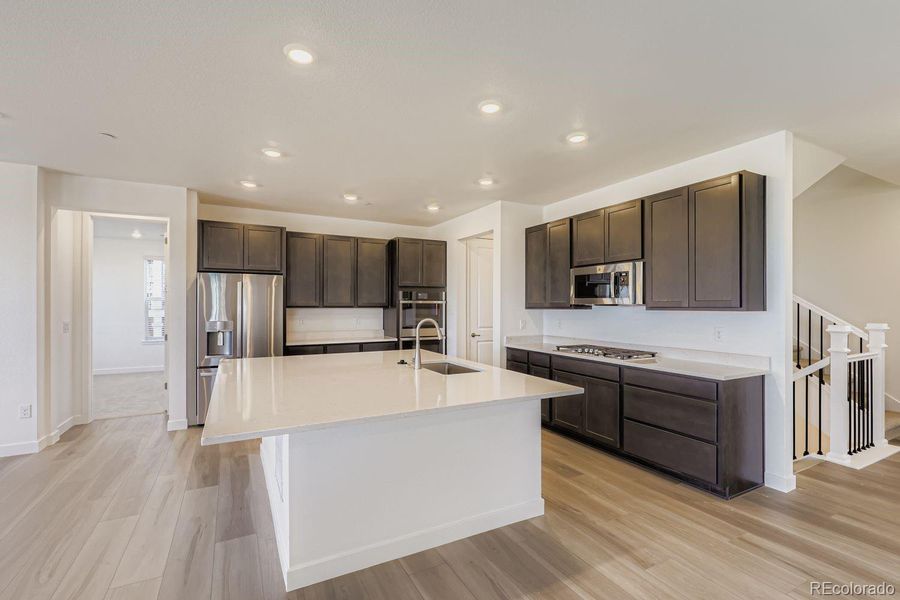 Furnished interior view inside a new home in Sunset Village: The Grand Collection, Erie (Image 5).
