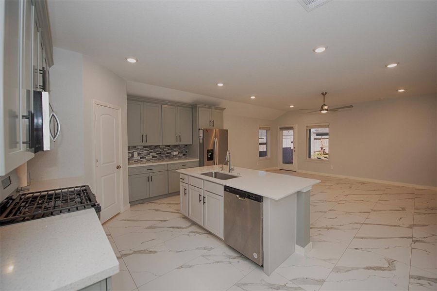 A view of the kitchen with ease of access to the family room. A view of the kitchen with ease of access to the family room.