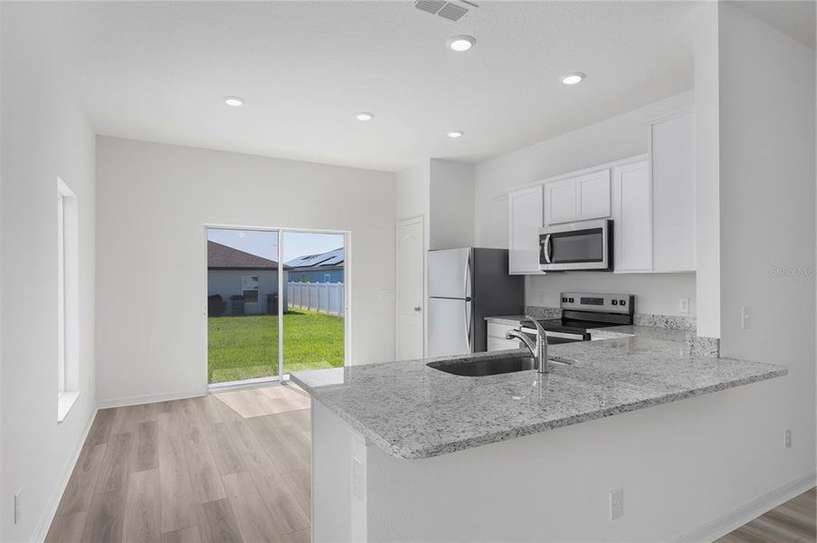 Furnished interior view inside a new home in Gum Lake Preserve, Lake Alfred (Image 7).