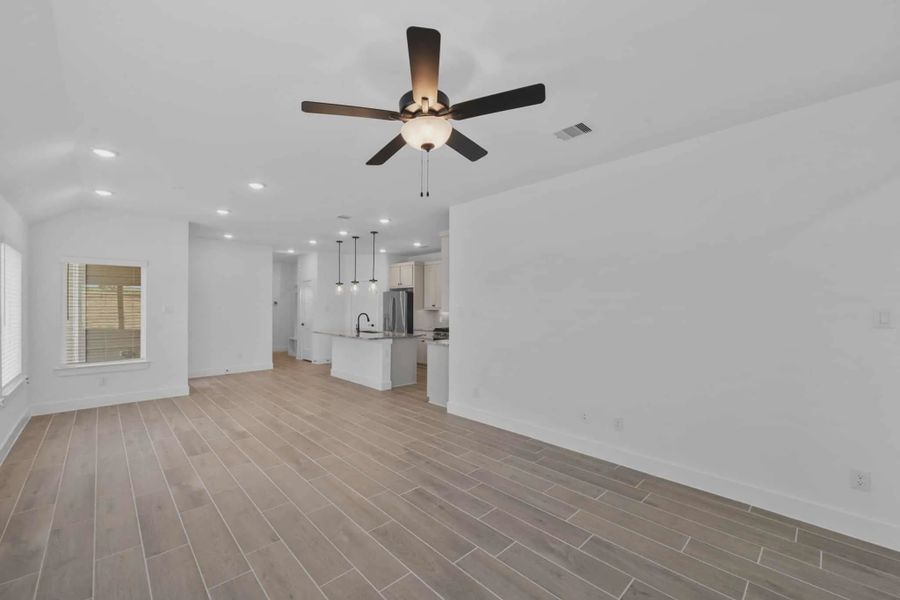 Representative unfurnished interior of a home built from the Carriagehouse by Chesmar Homes in Meridiana Townhomes, Iowa Colony (Image 23).