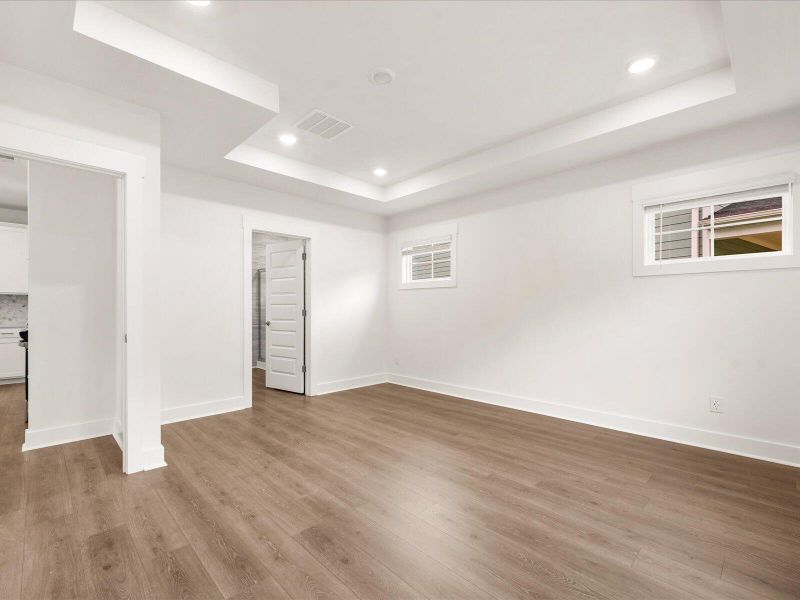 Spacious, unfurnished interior of a new home in The Coves at Lakes of Cane Bay, Summerville (Image 19).