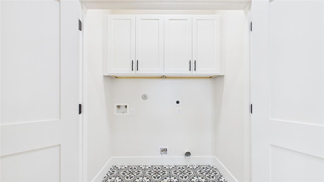 Convenient laundry closet with ample storage and stylish tile flooring. Convenient laundry closet with ample storage and stylish tile flooring.