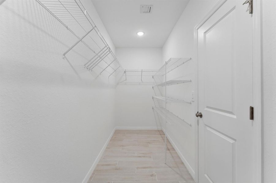 Primary Walk-in Closet Primary Walk-in Closet